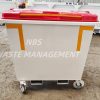 Large wheeled waste bin with a red lid, white body, and orange corner accents, labeled 'NBS WASTE MANAGEMENT'